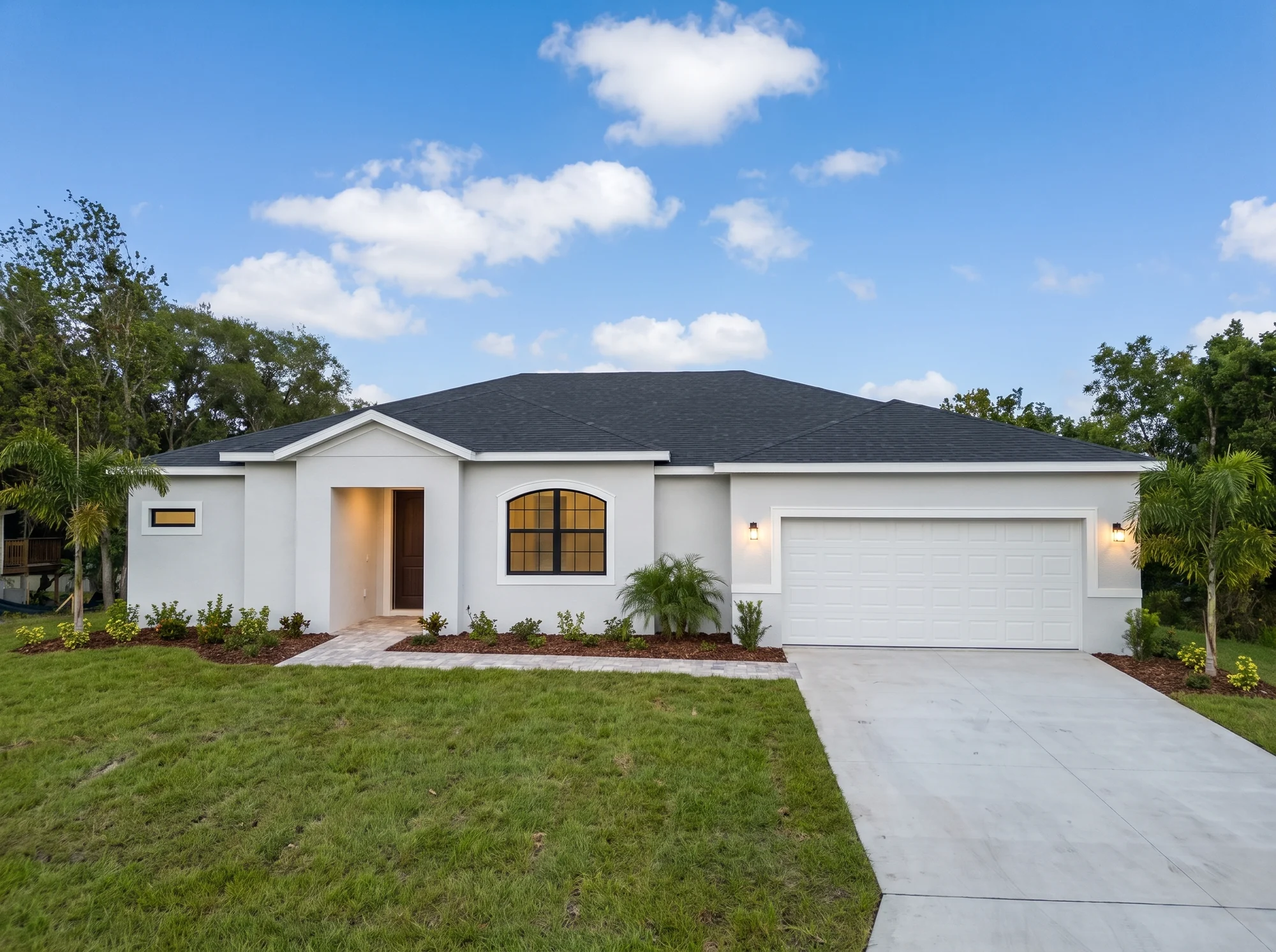Rendering of the finished stucco home with landscaping